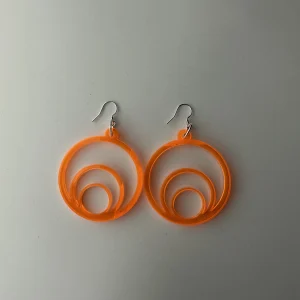 Round designer orange earrings